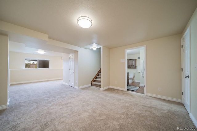 basement with light colored carpet