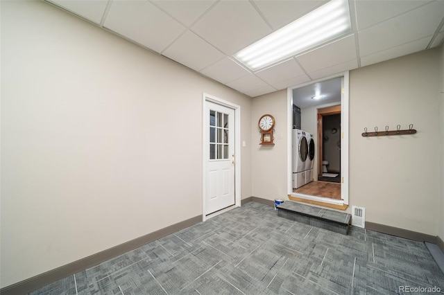 doorway to property with separate washer and dryer