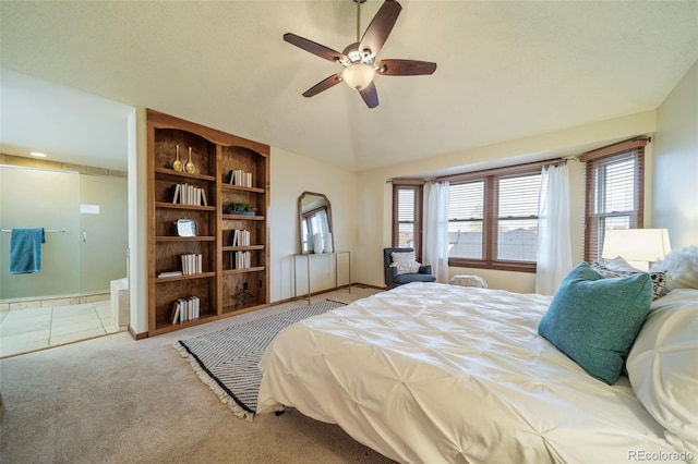 bedroom with carpet flooring, ceiling fan, and vaulted ceiling