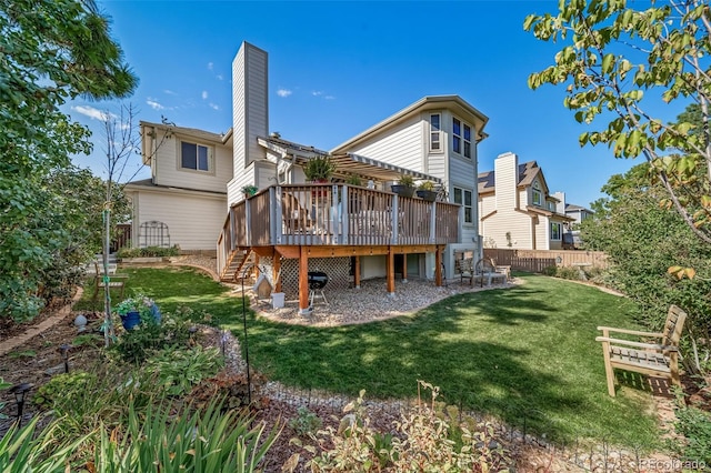 back of property with a lawn and a wooden deck