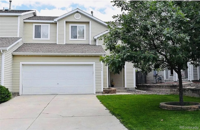 5546 S Quemoy Cir, Aurora, CO 80015 - view of front of property with a garage, driveway, a front yard, and roof with shingles