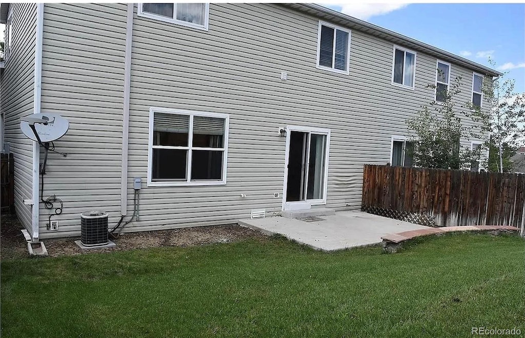 5546 S Quemoy Cir, Aurora, CO 80015 - rear view of house with cooling unit