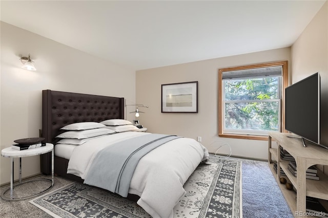 bedroom with baseboards and carpet flooring