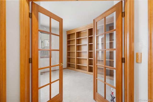 interior space with carpet flooring and french doors