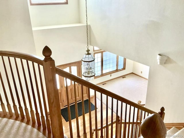 staircase featuring visible vents