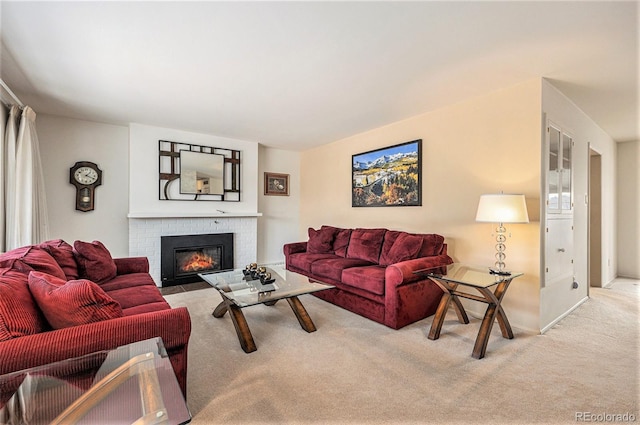 living room with carpet flooring and a fireplace