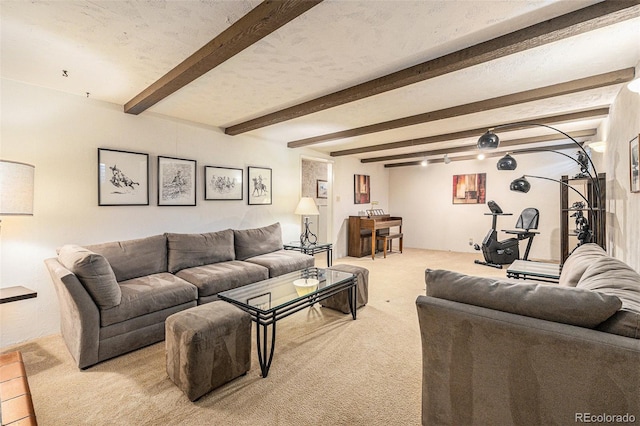 carpeted living room featuring a textured ceiling and beam ceiling