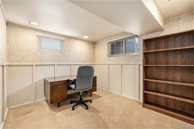 carpeted home office with crown molding, a wainscoted wall, a decorative wall, and wallpapered walls