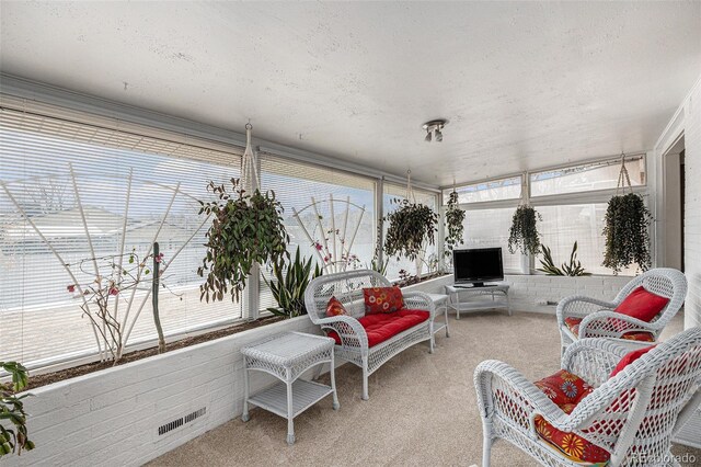 sunroom with a wealth of natural light and visible vents