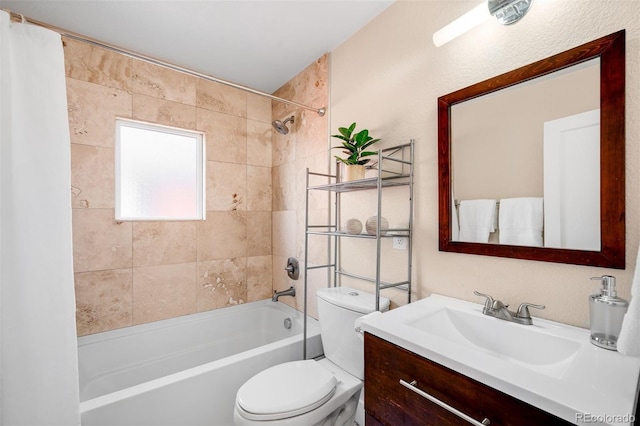 bathroom with toilet, shower / bath combo with shower curtain, and vanity