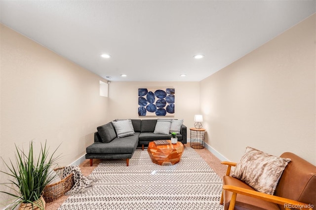 carpeted living room with recessed lighting and baseboards