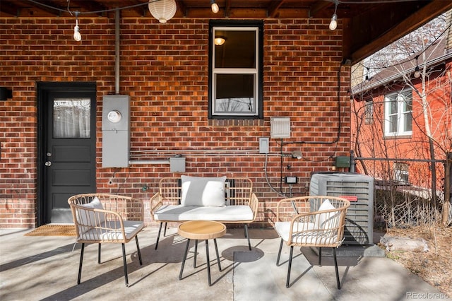 view of patio / terrace featuring cooling unit and fence