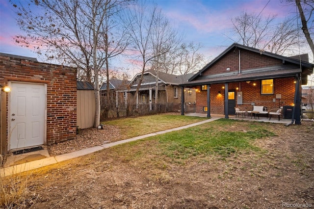 exterior space with a patio, a storage unit, an outdoor structure, and fence