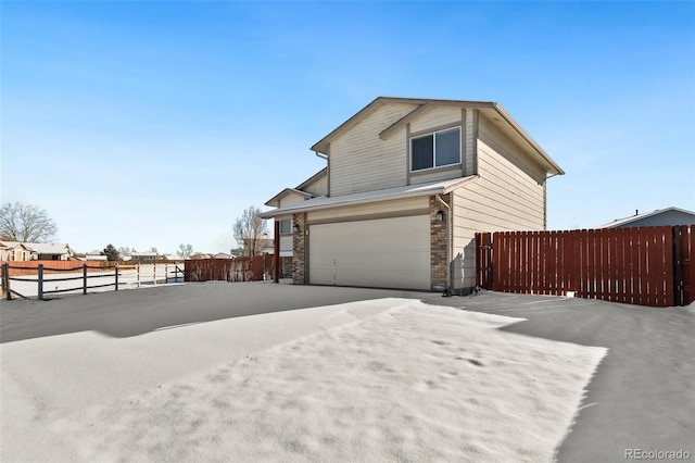 view of side of home featuring a garage