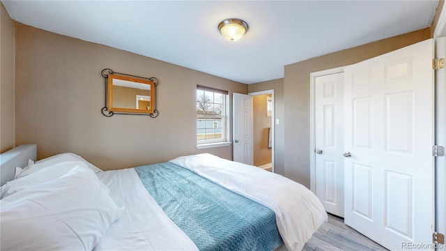 bedroom with light hardwood / wood-style flooring