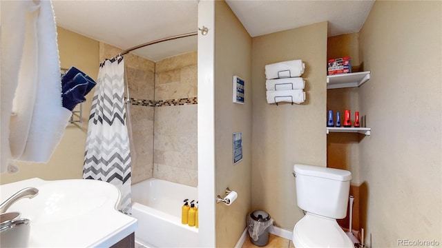 bathroom with shower / tub combo and toilet