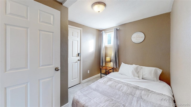 bedroom with light colored carpet