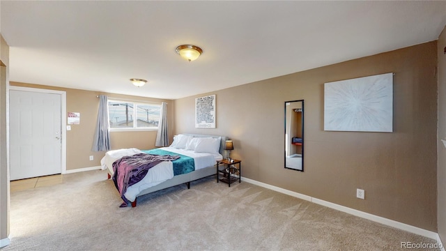 bedroom with light colored carpet