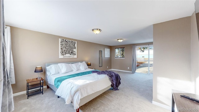 bedroom featuring light carpet