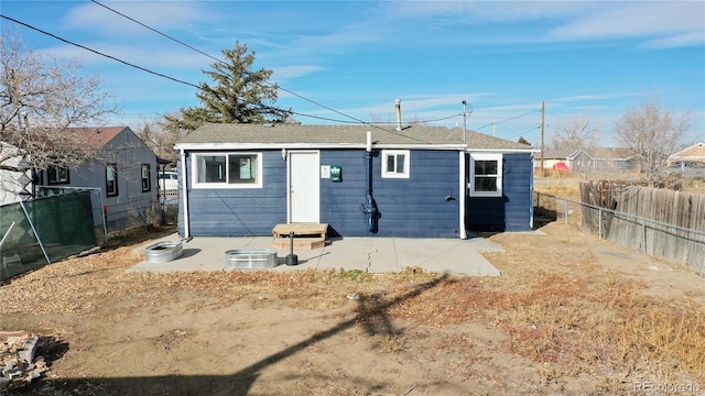 back of house with a patio