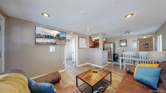 3282 W 66th Ave, Denver, CO 80221 - living room with light wood-type flooring, baseboards, and recessed lighting