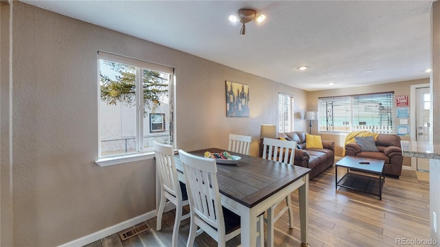 3282 W 66th Ave, Denver, CO 80221 - dining area featuring light wood-type flooring, recessed lighting, baseboards, and a textured wall
