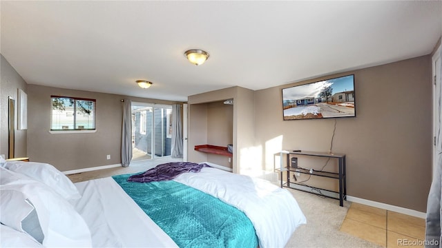 3282 W 66th Ave, Denver, CO 80221 - bedroom featuring baseboards, access to exterior, and light colored carpet