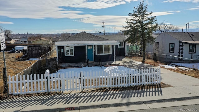 3282 W 66th Ave, Denver, CO 80221 - view of front facade with a fenced front yard and driveway