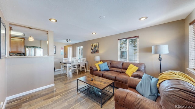 3282 W 66th Ave, Denver, CO 80221 - living area with baseboards, light wood-type flooring, plenty of natural light, and recessed lighting