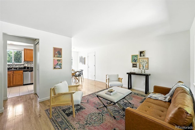 1380 Holly Dr E, Broomfield, CO 80020 - living room with light wood-style floors and baseboards