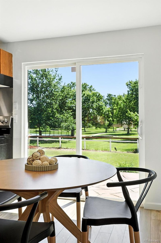 1380 Holly Dr E, Broomfield, CO 80020 - dining area featuring healthy amount of natural light and light wood-style flooring