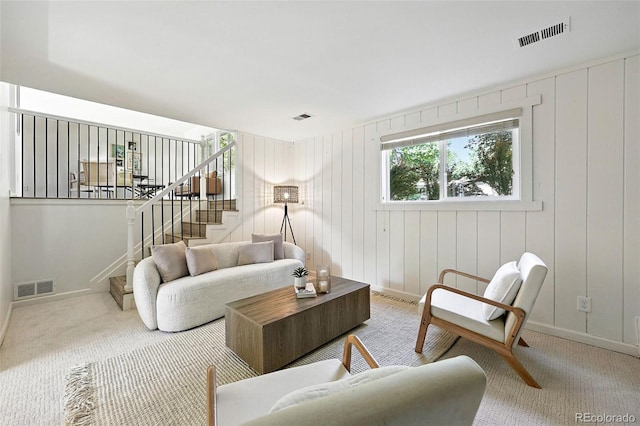1380 Holly Dr E, Broomfield, CO 80020 - carpeted living room featuring stairs and baseboards