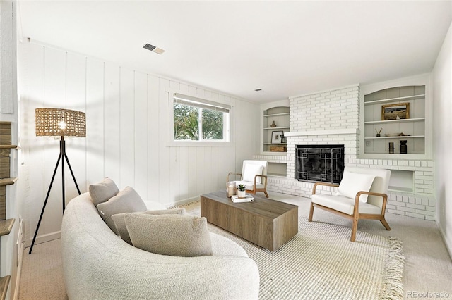 1380 Holly Dr E, Broomfield, CO 80020 - living room featuring built in shelves, a brick fireplace, and carpet flooring