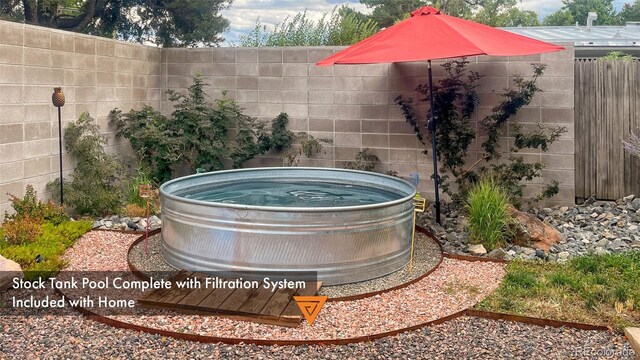 3650 Chimayo Rd, Littleton, CO 80123 - exterior view of fence and a hot tub