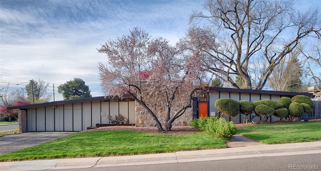 3650 Chimayo Rd, Littleton, CO 80123 - view of front of property with board and batten siding and a front yard