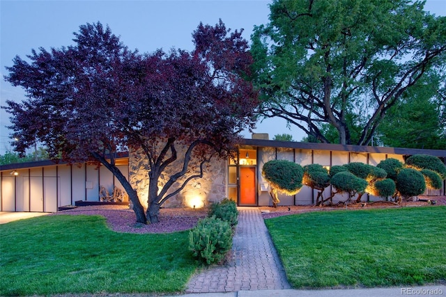 3650 Chimayo Rd, Littleton, CO 80123 - view of front of property featuring board and batten siding and a front yard