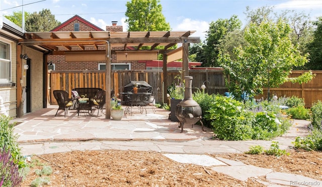 1185 Glencoe St, Denver, CO 80220 - fenced backyard featuring a pergola and a patio