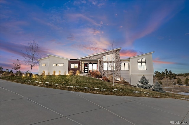 view of front of home with a yard