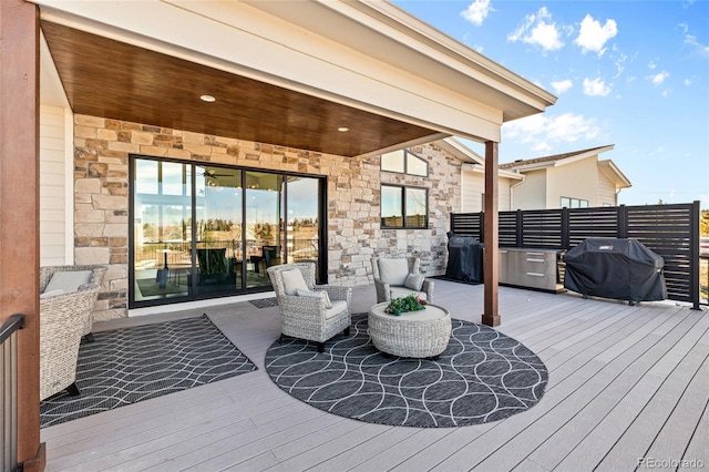 wooden terrace with area for grilling