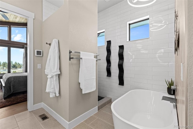 bathroom with plus walk in shower and tile patterned floors