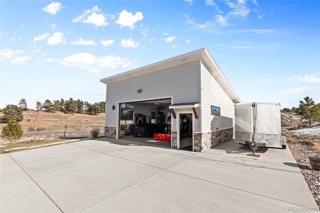 view of side of property with a garage