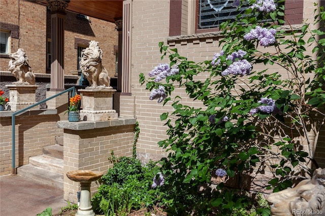 exterior details featuring brick siding