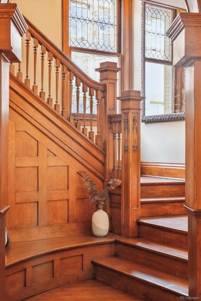 staircase with a towering ceiling