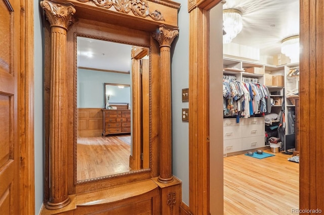 interior space featuring ornamental molding and wood finished floors