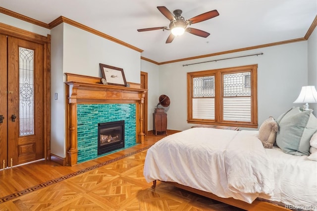 bedroom with baseboards, crown molding, access to outside, and ceiling fan