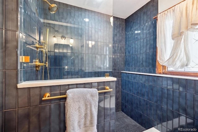 full bath featuring a walk in shower and tile walls
