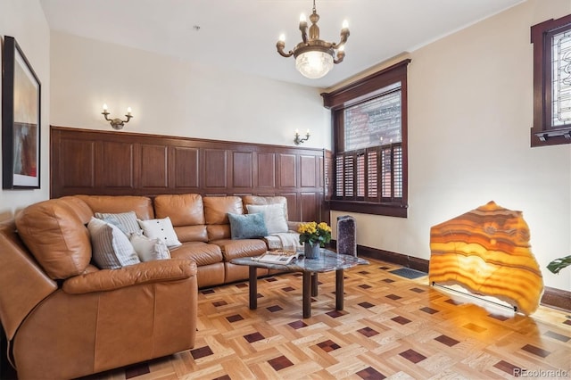 1022 N Pearl St Unit 101, Denver, CO 80203 - living area featuring baseboards and a notable chandelier