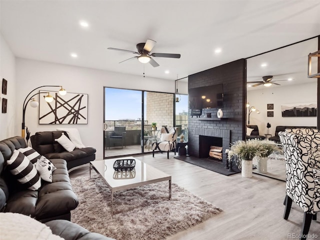 800 N Pearl St Unit 1203, Denver, CO 80203 - living area with ceiling fan, wood finished floors, a brick fireplace, and recessed lighting