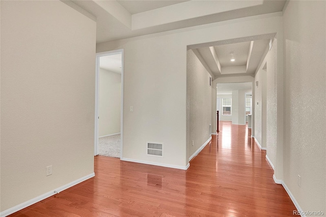 16076 Columbine Pl, Thornton, CO 80602 - hallway featuring a raised ceiling, light wood finished floors, and baseboards