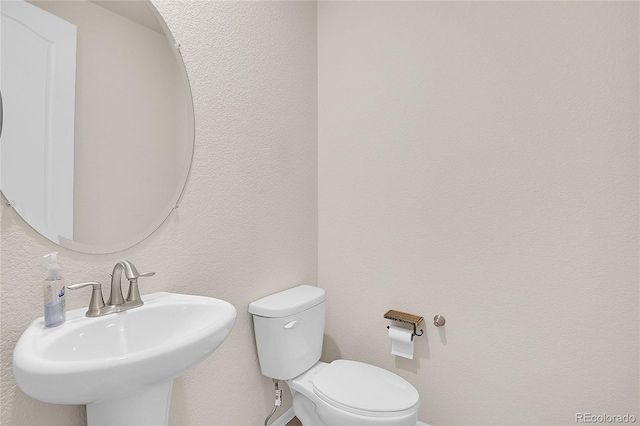 16076 Columbine Pl, Thornton, CO 80602 - half bathroom featuring a sink and toilet